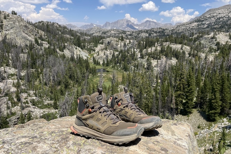A closeup of the Altra Lone Peak Hiker 3 boots sitting on a rock in the Wind River Range of Wyoming