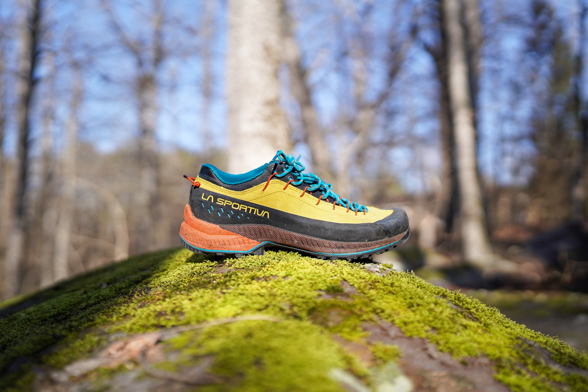 The La Sportiva TX4 Evo hiking shoe sitting on a mossy rock