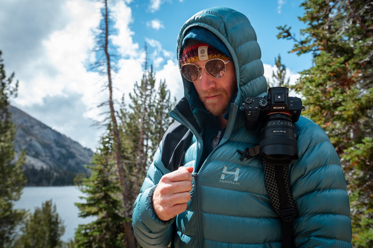 Zipping up the Himali Accelerator Men's Down Jacket