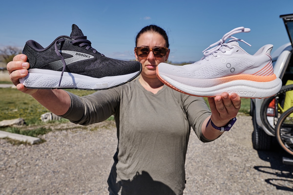 a woman holds two shoes side by side to show their materials