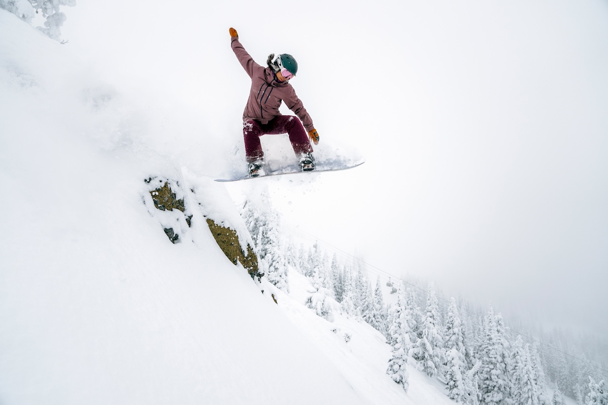 A snowboarder in midair at Mission Ridge resort