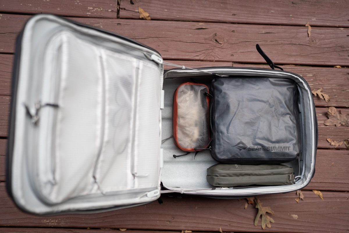 Packing cubes are packed and neatly laid into a carryon suitcase.