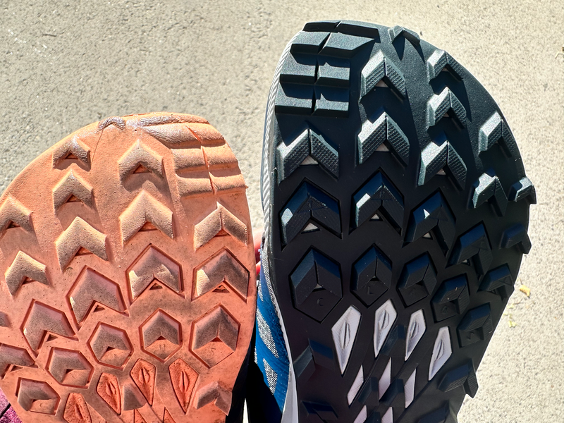 The outsole of an older pair of shoes compared with the new pair side by side