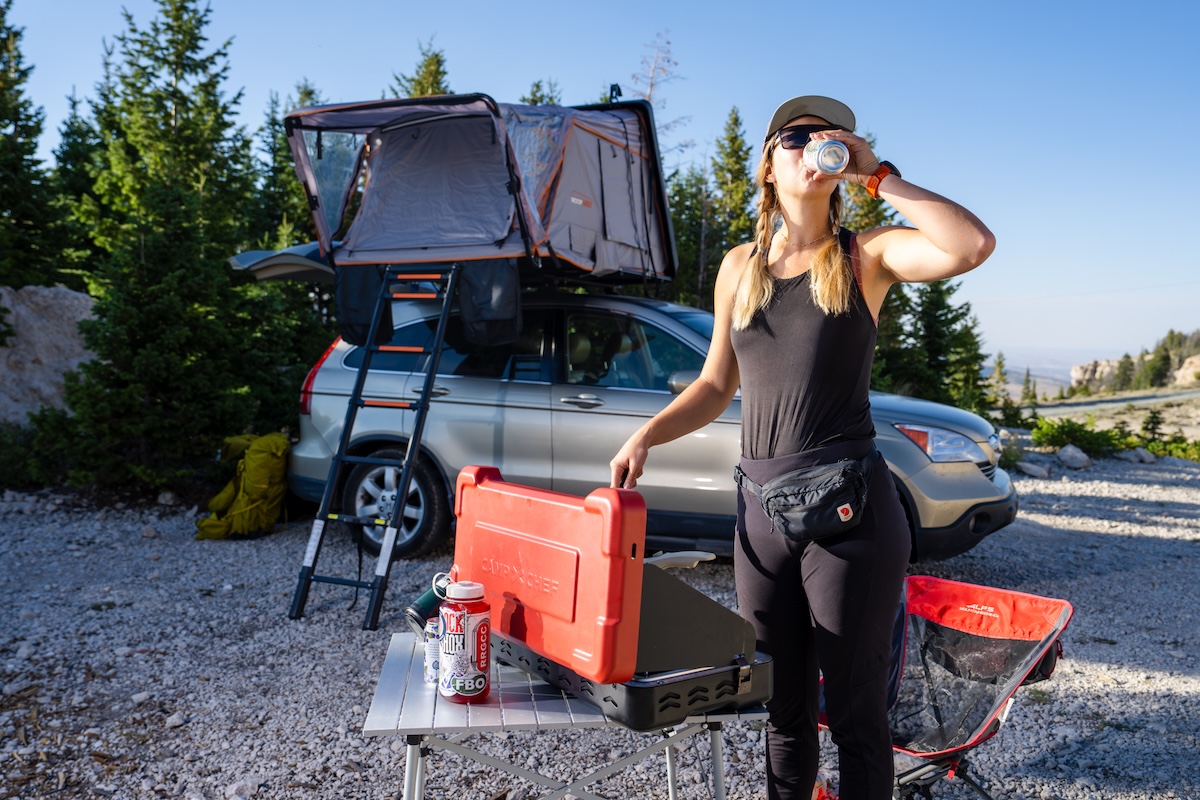 Enjoying a brew while cooking on the Everest