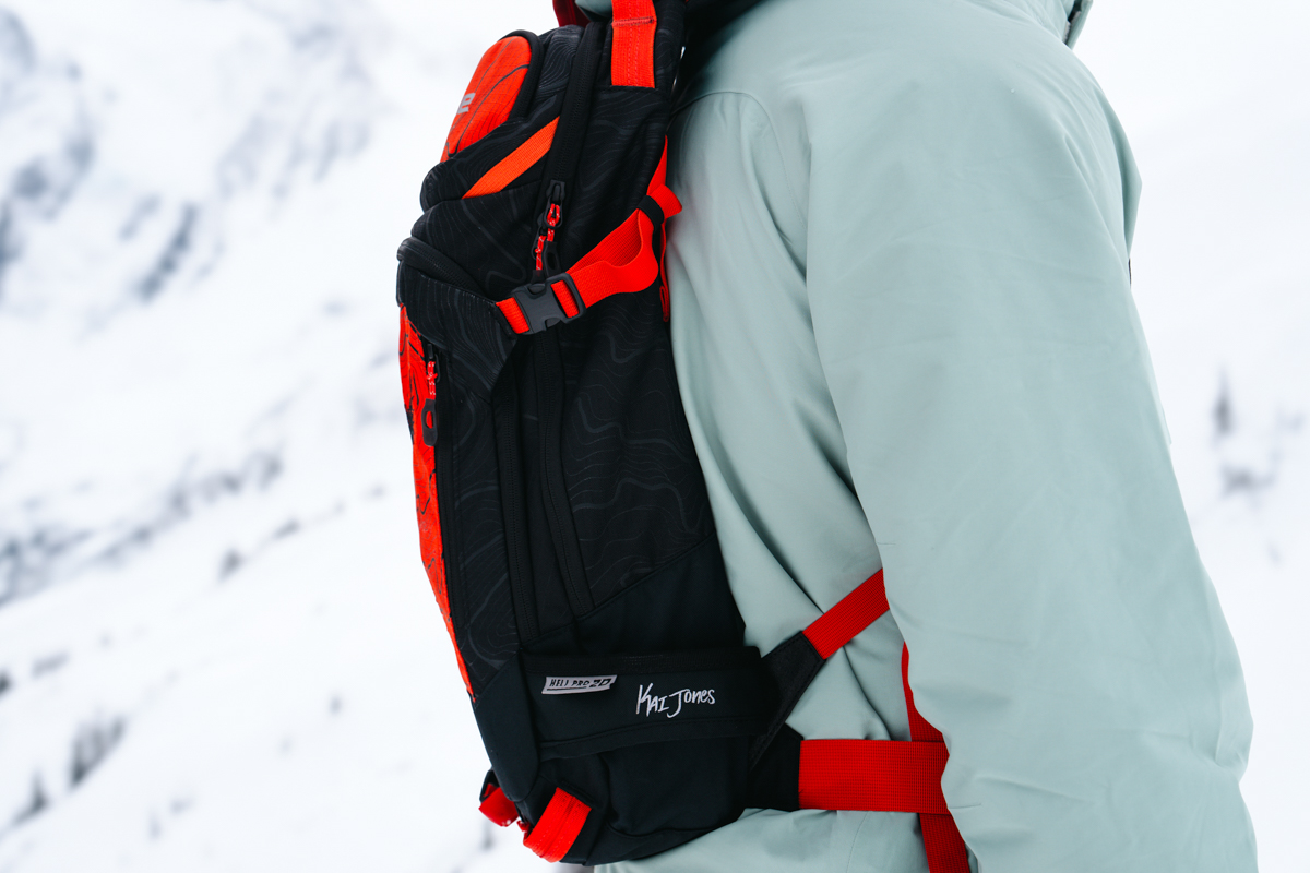 A close up of the side of a red ski backpack