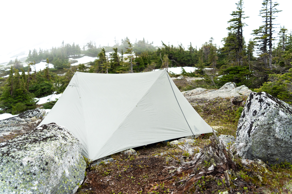 A backpacking tent pitched in the snowy alpine