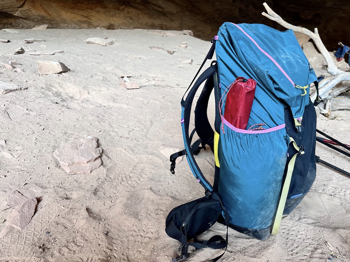The Gossamer Gear Mariposa backpack shown from the side in the desert