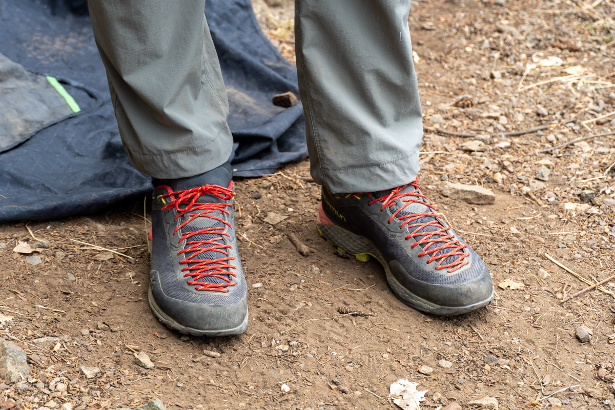 A top view of the upper on a pair of grey and red approach shoes