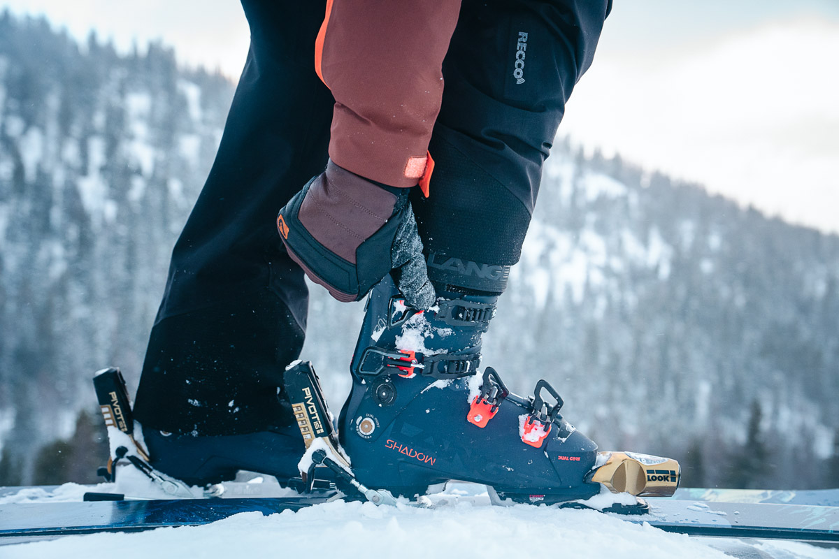 Adjusting the cuff on a blue ski boot