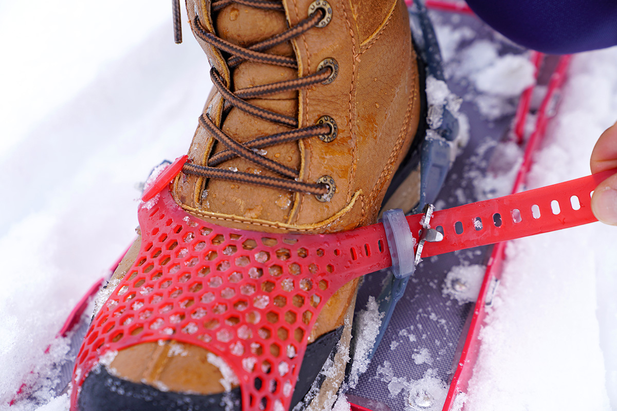 A close up of the front binding on a snowshoe