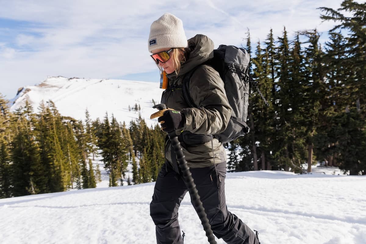 A woman out for a day of backcountry skiing in the DAS Light Hoody