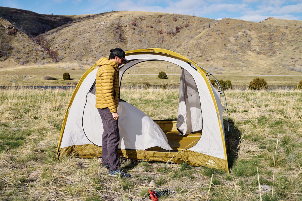 REI Co-op Base Camp 6 (standing in front of tent)
