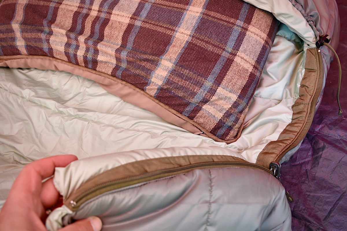Showing the material and construction of the REI Co-op Siesta Hooded 20 Sleeping Bag