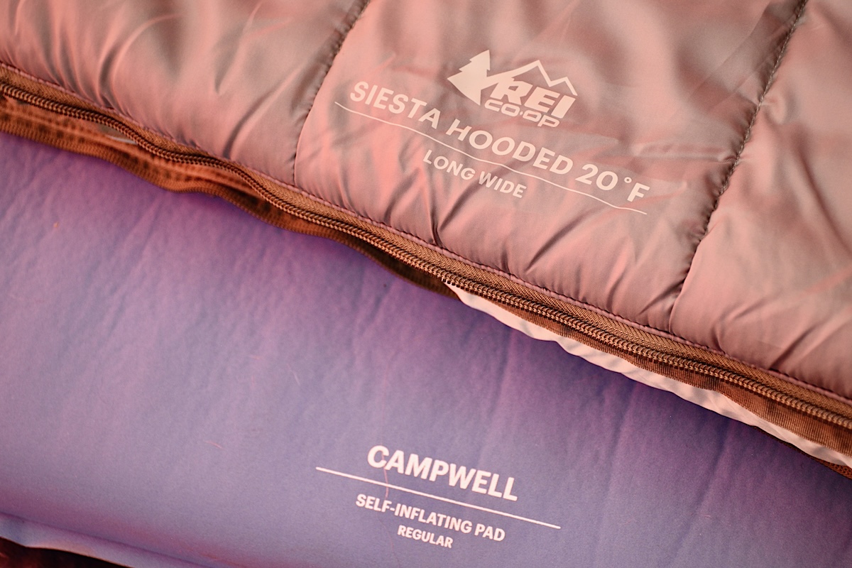 Showing the product name and logo of an REI sleeping bag and mattress
