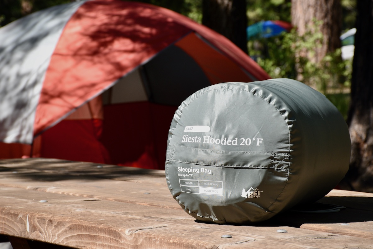 The Siesta Hooded 20 in its stuff sack showing the available sizes